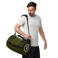 a man carrying a black duffel bag