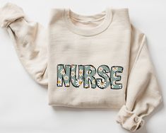 a sweater with the word nurse printed on it