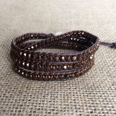 "This is a beautiful brown Bohemian beaded wrap bracelet and it would make the perfect Valentines Day gift for that special person in your life. If you're looking for a brown wrap bracelet to complete your favorite outfit you can't go wrong with this wrap bracelet. It is comfortable enough to wear all day at work and leave it on for a night out. You'll never want to take it off. This wrap bracelet is made with top quality leather cord and Czech glass beads in dark bronze. This bracelet measures Bohemian Hand Wrapped Brown Bracelets, Spiritual Brown Bracelets For Festivals, Spiritual Brown Bracelet For Festivals, Beaded Brown Friendship Bracelets As Gift, Brown Beaded Friendship Bracelets As Gift, Adjustable Brown Beaded Friendship Bracelets, Adjustable Brown Bohemian Friendship Bracelets, Adjustable Brown Beaded Bracelets For Festivals, Adjustable Bohemian Brown Friendship Bracelets