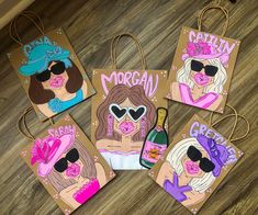 four paper bags with different images of women wearing hats and sunglasses, one holding a wine bottle