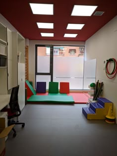 a room with several different colored furniture in it