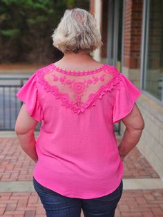 Experience effortless elegance in our V-Neck Ruffle Sleeved Top in Fuchsia! Featuring a delicate v-neckline with lace trim and charming short ruffled sleeves, this top is sure to turn heads. The lace yoke on the back adds a touch of femininity and grace, making it a must-have addition to your wardrobe. Elevate your style with this stunning top! ABOUT THIS ITEM: Made in China. Fabric is: Shell - 100% Polyester. Contrast - 100% Polyester. Hand wash inside out. Hang or line dry. The Model is 5'9, a Maxi Tops, Stunning Tops, Loungewear Sets, Ruffled Sleeve Top, Jumpsuit Shorts Rompers, Ruffled Sleeves, Effortless Elegance, Neck Ruffle, Sleeveless Sweater