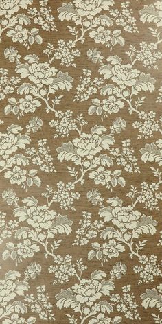 a brown and white wallpaper with flowers on it