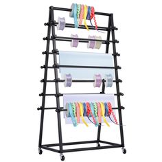 a rack that has several rolls of tape on it and two roll holders in the middle