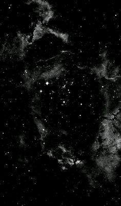 a black and white photo of the night sky