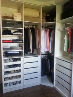 an organized closet with clothes and shoes