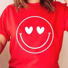 Red Heart Eyes Smiley Face Valentine Graphic Tee 100% Airlume Cotton Valentines Valentine Graphic, Valentines Graphic Tee, Pink Choker, Metallic Shorts, Green Polo Shirts, Black Short Sleeve Shirt, Drop Shoulder Tee, Embroidered Tee, Red T