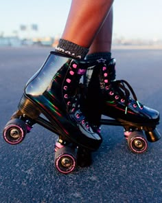 a close up of a person riding roller skates