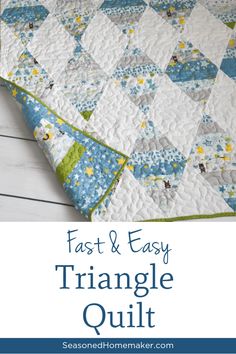 an easy triangle quilt with the words fast and easy triangle quilt written on it in blue