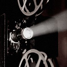 a black and white photo of an oven with the light coming from it's burner