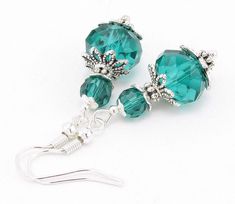 These Emerald Crystal Glass Beaded Earrings are striking and romantic!   💎 Earrings feature sparkly Emerald Faceted Crystal Glass beads. The large rondelle bead measures 12mm x 9mm. The smaller round bead measures 6mm.  💎 The beads are accented by finely-detailed filigree bead caps and spacer beads.  💎 Earring hooks are silver-plated, lead and nickel-free for sensitive ears.  💎 Earrings hang approximately 1.75 inches long.  Enjoy wearing these as a gift to yourself! Or give them as a gift to the Happy Girl in your life! Want to see more items like these? You can find many more styles like this in the Earrings Section of my shop: https://www.etsy.com/shop/SparklyBliss?section_id=15698941&ref=shopsection_leftnav_1 FREE Microfiber Jewelry Polishing Cloth with any purchase of $25.00 and ov Crystal Bead Earrings, Romantic Earrings, Emerald Crystal, Jewelry Summer, Handmade Glass Beads, Spring Jewelry, Earrings Green, Handmade Jewelry Diy, Jewelry Unique