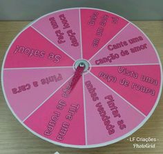 a pink and white clock with spanish words on it