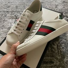 Brand New Classic Gucci Ace Sneakers From Nordstrom At Westfield Century City & Never Ended Up Wearing Them Either Because They Are A Half Size Too Big. Tags & Original Box Included. All White With The Croc Green Leather Emblem On The Back! Just Honestly Cleaning Out My Closet. Sizing Is Super Confusing They Are A Gucci Size 5, But Eu 39. These Shoes Run Large Even On The Website They Recommend Choosing Half A Size Down From Your Regular One. They Fit More Like A Women’s 8/8.5 Or Men’s 7. I’m No White Gucci Shoes, Westfield Century City, Mickey Mouse Shoes, Gucci Ace Sneakers, Duck Shoes, Hightop Sneakers, Gucci Sneakers, Century City, Leather High Tops