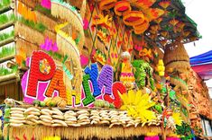 an elaborately decorated display in the shape of letters and numbers for sale at a street fair