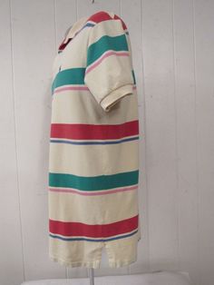 "Vintage 1980s or 90s color block striped cotton polo shirt. Made in the U.S.A. by Polo Ralph Lauren. Has embroidered Polo horse and jockey on chest. Size medium. Actual measurements are: 43\" at the chest 42\" at the waist 18.5\" shoulder seam to shoulder seam 31\" overall length In very good condition." White Horizontal Stripe Cotton Polo Shirt, White Cotton Polo Shirt With Horizontal Stripes, Cotton Collared Polo Shirt With Vertical Stripes, White Striped Cotton Polo Shirt, Casual Striped Cotton Polo Shirt, Cotton Polo With Vertical Stripes, Cotton Polo Shirt With Vertical Stripes, Cotton Short Sleeve Polo Shirt With Vertical Stripes, Cotton Polo Collar Top With Vertical Stripes