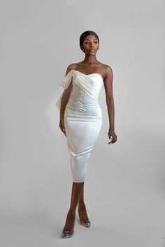 This lovely draped off-the-shoulder dress features a sweetheart neckline, pleated panel at the chest flowing down to the waist, and stunning hand-beaded embroidery around the waist. The white details, a combination of pearls and sequins, are meticulously hand-fixed to perfection. With a midi pencil silhouette, this dress allows you to showcase your favorite shoes. Pair it with single-strap high-heeled sandals for a chic and elegant look. Features: *Draped Off-the-Shoulder Design: Elegant and fla Dress With Pearls Detail, White Dress Midi, Midi White Dress, Dress With Pearls, Hand Beaded Embroidery, Dress Drape, Pearl Dress, Statement Dress, White Midi Dress