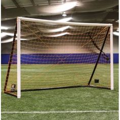 a soccer goal in the middle of an indoor field