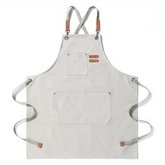 a white apron with two pockets and straps