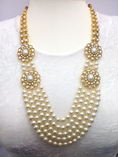 "Pearl and Cubic Zirconia Gold Plated Handmade Bridal Party Wear /Rani haar/ Anarkali Jewellery Set Necklace Earrings and Tika Wedding Jewellery 1-Necklace, 1-Pair Earrings, 1-Headpiece/Tika,  Earrings Length: 3.4\"inches  Necklace Length: 11.5\"inches  Item Code: WATI:9520-270 Traditional Indian Wedding Jewellery  Slight Colour variations possible due to difference in screen and photograph" White Bridal Necklace For Festivals, White Jewelry For Diwali Party, White Jewelry Sets For Wedding On Eid, White Bridal Necklace For Diwali Party, Pearl Bridal Necklace For Reception And Festivals, Festive White Jewelry With Stone Work, Pearl Kundan Necklace For Diwali Reception, Festive Reception Kundan Necklace With Pearls, White Bollywood Jewelry For Festive Occasions