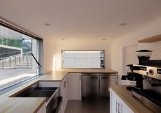 the kitchen is clean and ready to be used as a coffee shop or office space