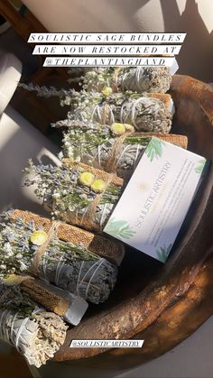 an arrangement of flowers and herbs on display in a wooden bowl with text overlay