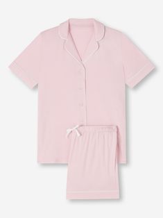 Perfect for lounging in when you get home from work, a good night's sleep and then breakfast round the table in the morning - our ballet pink Lara jersey shortie pyjamas work effortlessly as a versatile modern take on the classic pyjama. Designed for a flattering but comfortable shape, our women's shortie pyjamas will keep you looking great and feeling comfortable throughout the seasons. The short sleeve jacket top features a fully piped finish in a contrasting white piping for a stylish appeara Light Pink Pajamas, Pink Relaxed Fit Pajama Shorts For Loungewear, Cute Pink Pajama Shorts, Feminine Pink Sleepwear For Lounging, Pink Fitted Pajama Shorts, Pink Fitted Short Pajama Shorts, Comfortable Pink Pajama Shorts, Pink Short Loungewear Sleepwear, Feminine Pink Cotton Pajama Shorts