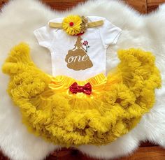 This listing is for Baby girl's Belle theme First Birthday outfit .  Includes  1.Bodysuit 2.Premium fluffy Pettiskirt 3. Headband  Shoes sold separately  https://www.etsy.com/listing/840596116/baby-girl-shoes-golden-baby-shoes-belle?ga_search_query=Shoes&ref=shop_items_search_1&crt=1 Name can be added on the bodysuit. Please leave a note in the note to seller box upon checkout for personalization. Bodysuit used is carter's brand . Carter's Bodysuit is Crafted in babysoft cotton,  Easy to change Beauty And The Beast One Year Old Party, Beauty And The Beast 1st Birthday Party, Beauty And The Beast 1st Birthday, Beauty And The Beast First Birthday, Princess Belle Party Decorations, Belle Birthday Outfit, Princess Belle Party, Belle Birthday Party, Beauty And Beast Birthday