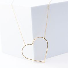 14k yellow gold asymmetrical heart on dainty 1.2mm flat cable link chain. chain length is 18” heart is approximately 2” 14k Gold-filled Heart Necklace With Delicate Chain, Delicate Chain Heart Necklace In 14k Gold Filled, 14k Gold Heart Necklace With Adjustable Chain, Everyday Open Heart Chain Necklace, Everyday 14k Gold Open Heart Necklace, Minimalist Yellow Gold Chain Necklace With Heart Pendant, Minimalist Yellow Gold Heart Pendant Chain Necklace, Minimalist Heart Necklace With Cable Chain, Yellow Gold Open Heart Necklace With Delicate Chain