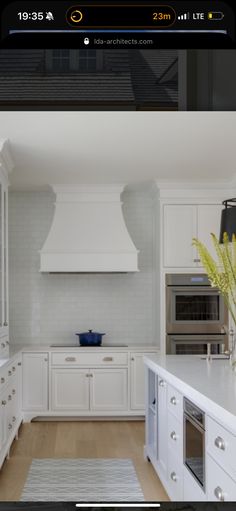 an image of a kitchen with white cabinets and counter tops on the appliance