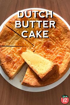 a white plate topped with a cake on top of a wooden table