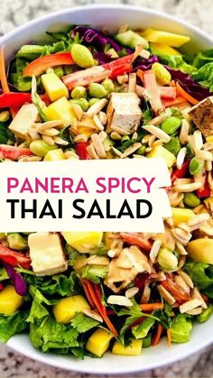 a bowl filled with lots of different types of food and the words panera spicy thai salad