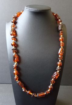 Vintage Tortoise Shell Beaded Necklace 1960's 1970's Jewelry Measurements Length - 22 1/2 inches In very good vintage condition. A nice addition to any collection. D201 Vintage Amber Jewelry With Large Beads, Vintage Amber Beaded Necklaces, Handmade Retro Brown Necklaces, Retro Brown Handmade Necklaces, Retro Brown Beaded Jewelry, Retro Handmade Brown Necklaces, Vintage Hand-strung Beaded Necklace With Round Beads, Vintage Oval Beaded Necklaces For Jewelry Making, Vintage Single Strand Beads For Formal Occasions