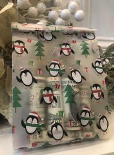 a penguin christmas present wrapped in wrapping paper