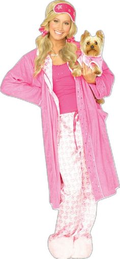 a woman in pajamas holding a small dog wearing a pink hat and robe on top of her head