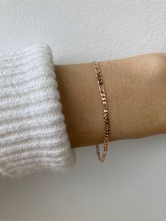 This little bracelet makes a great everyday piece. Wear it alone for a minimal look or stack with other delicate bracelets. D E T A I L S  *Made with a shiny and polished 18k gold filled/rose gold filled figaro chain.  *Chain measures Long Link: 5.5mm x 2.35mm and the Short Link: 3.5mm x 2.4mm *Gold fill is a wonderful alternative to real gold and unlike gold plating does not rub off. It features a real layer of gold pressure bonded to a base metal *It closes with a gold fill spring clasp and all the findings are gold filled too. S I Z I N G *  H E L P *Choose the length from the drop down menu. Use the length guide as a reference.   C A R E * T I P This is a dainty bracelet so please treat it with care. To keep your jewellery in great condition it is always best to avoid water however if Trendy Rose Gold Bracelet With Delicate Chain, Minimalist Figaro Chain Bracelet, Minimalist Adjustable Figaro Chain Bracelet, Minimalist Gold Bracelet With Figaro Chain As Gift, Minimalist Gold Bracelet With Figaro Chain, Minimalist Gold Figaro Chain Bracelet, Rose Gold Chain Bracelet With Adjustable Chain For Everyday, Everyday Rose Gold Chain Bracelet With Adjustable Chain, Minimalist Rose Gold Paperclip Bracelet For Everyday Wear