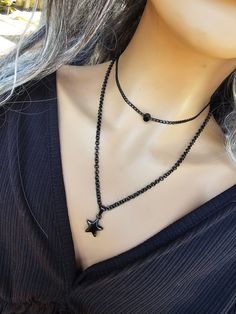 This is a blackened steel Gothic Necklace great alone or layered with others. Choose one or both!  The minimalist design gives it a trendy and stylish feel, while the black steel gives it a touch of gothic Punk edge. The choker with square bead necklace runs from 14 to 16 inches with a built-in extender.  The Star necklace runs from 16 to 18 inches with built-in extender.  This is a dainty chain, but is strong steel.. 💗NOTE ABOUT DELIVERY TIMES FOR FREE SHIPPING💗 This is shipped via tracked pa Edgy Adjustable Star-shaped Jewelry, Adjustable Edgy Star Jewelry, Adjustable Edgy Star-shaped Jewelry, Adjustable Star-shaped Edgy Jewelry, Edgy Black Stainless Steel Necklace, Edgy Star Charm Jewelry As A Gift, Edgy Star-shaped Metal Jewelry, Gothic Black Star Necklace, Black Gothic Star Necklace