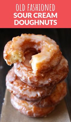 three donuts stacked on top of each other with the words old fashioned sour cream doughnuts