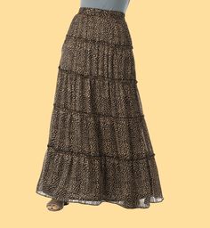 A must have skirt for every boho girl's wardrobe! Our lightweight, cheetah tiered maxi skirt features an elastic waist and tiered hemline. Pair it with sandals and a tee or dress it up with heels for a night out. Runs small- Please go up two size for comfort fitting. 40inch length full lined Hand-wash Relaxed Tiered Maxi Skirt For Vacation, Tiered Maxi Skirt For Vacation With Relaxed Fit, Beach Tiered Maxi Skirt, Flowy Maxi Skirt With Layered Hem, Bohemian Flowy Maxi Skirt With Layered Hem, Bohemian Tiered Maxi Skirt With Layered Hem, Tiered Maxi Skirt With Layered Hem, Casual Maxi Dress With Tiered Gathered Skirt, Casual Maxi Dress With Gathered Tiered Skirt