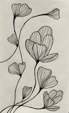 a drawing of three flowers on a white paper with the words love written in black ink