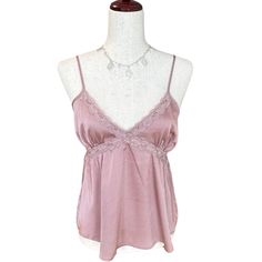 Cute Satin-Lace Cami Top Crisscross Lace Trim At The Front Lends A Little Beauty To This Flowy Camisole Top From Hippie Rose. Details: * Size : Medium (Measurements See Photos) * Color : Lilac-Mauve * Pullover With Adjustable Spaghetti Straps * Material: 95% Polyester, 2% Spandex * The Item In The Photos Is The Exact Item That Will Be Shipped. Condition: New Bundle And $Ave Love The Item But Not The Price? Make An Offer (Reminder Poshmark Gets 20%) About Me: *Always Open To Reasonable Offers (Reminder Poshmark Gets 20%) *Strive To Ship Same Or Next Business Day *More Questions Or Need More Photos Just Ask! Thank You For Shopping My Closet! Keywords: Spring, Summer, Fall, Winter, C Purple Camisole Tank Top For Night Out, Feminine Sleeveless Purple Top, Pink Sleeveless Tank Top With Delicate Straps, Fitted Lavender Sleeveless Camisole, Fitted Sleeveless Lavender Camisole, Feminine Purple Camisole Top, Chic Purple Cami Tank Top, Purple Camisole For Night Out In Spring, Elegant Purple Camisole For Summer