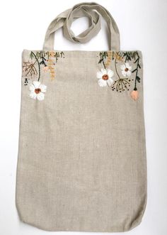 a bag with flowers and leaves on it