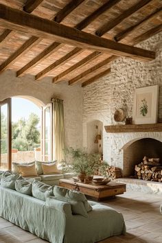 Spacious Tuscan-style living area with earth tone color palette, exposed beams, and comfortable seating Italian Cottage Decor, Italian Interior Aesthetic, Italy House Interior, Old Italian House Interior, Italian House Interior, Italian Villa Decor, Italian Color Palette, Italian Style Living Room, Garden Provence