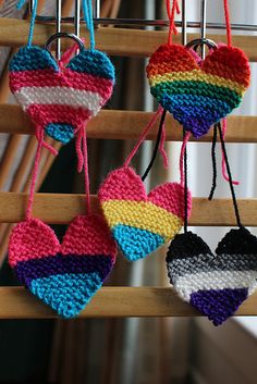 crocheted heart shaped ornaments hanging from strings