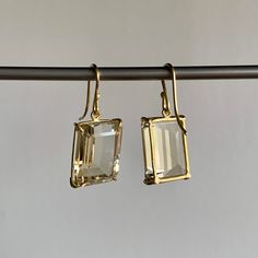 The glistening champagne tones in these opulent citrines will make every day a soirée. 18k gold setting, 14k gold ear wiresCitrines 13mm x 16mm (1/2" x 5/8")Earrings hang 1 1/8" from the ear Each earring weighs 3.3g Gold Gemstone Earrings For Formal Occasions, Formal Yellow Gold Topaz Earrings, Yellow Gold Crystal Drop Earrings For Formal Events, Yellow Gold Crystal Drop Earrings For Formal Occasions, Gold Faceted Earrings For Evening, Elegant Formal Citrine Earrings, Formal Yellow Gold Crystal Drop Earrings, Formal Topaz Earrings, Luxury Gold Topaz Earrings