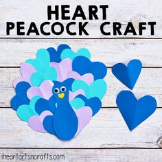 paper heart peacock craft for valentine's day on a wooden background with the words heart peacock craft