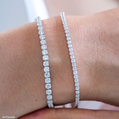 This exquisite dainty diamond CZ tennis bracelet features shimmering 2mm and 3mm cubic zirconia stones, offering the brilliance of diamonds at an accessible price. Crafted in a sleek, minimalist design, the bracelet exudes elegance and simplicity, making it perfect for everyday wear or special occasions. Its delicate yet durable construction ensures a comfortable fit and timeless appeal. Ideal as a birthday gift, anniversary present, or a thoughtful surprise for someone special, this minimalist white tennis bracelet is a must-have addition to any jewelry collection. DETAILED DESCRIPTION// Material: 925 sterling silver  Stone:  White diamond cz  Size of stone: 2mm, 3mm Length: 16+5 cm adjustable (6.3 inches + 2 inches)  Weight: 3.64g (2mm), 5,76g (3mm) //OUR COMMITMENT: WHAT YOU SEE IS EXAC Dazzling Diamond Tennis Bracelet With Sparkling Stones, Dazzling Diamond Bracelet With Sparkling Stones, Dainty Cubic Zirconia Diamond Cut Bracelet, Adjustable Diamond White Tennis Bracelet, Adjustable Dazzling White Gold Tennis Bracelet, Dazzling Adjustable White Gold Tennis Bracelet, Diamond Bracelet With Sparkling Round Cut Stones, Adjustable Tennis Bracelet With Vvs Clarity, Diamond White Bracelet With Sparkling Round Cut Stones