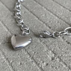 We love stainless steel jewelry! It can look sleek, punky and also lend itself to a hippyish aesthetic.▪️▪️▪️PRODUCTWomen Solid Heart Charm Cable Chain Bracelet316L surgical stainless steel Never Fade and HypoallergenicCare instructions: avoid contact with liquids (water, perfume, beauty products) wipe dry with a soft cloth.***VISIT STORE FOR MORE PRODUCT***🔗 https://www.etsy.com/ca/shop/TWISTEEL▪️▪️▪️ S H I P P I N G  All orders will be shipped on the next business day. UNITED STATES  - USPS F Adjustable Heart Shape Stainless Steel Charm Bracelet, Adjustable Heart-shaped Stainless Steel Charm Bracelet, Minimalist Stainless Steel Heart Bracelet As Gift, Heart Shaped Metal Bracelet With Adjustable Chain, Heart-shaped Metal Bracelet With Adjustable Chain, Heart-shaped Stainless Steel Bracelet For Friendship, Silver Heart-shaped Alloy Bracelets, Trendy Adjustable Heart Chain Bracelet, Hypoallergenic Heart-shaped Stainless Steel Bracelets