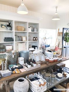 a room filled with lots of different types of items on top of a wooden table