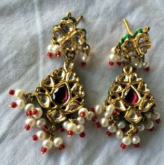 "22K Gold Polki Diamond Earrings pair with Beautiful Enamel work Fine jewelry. Weight of Pair-22 Grams, Size-2\"." Temple Jewelry Earrings For Celebration, Traditional Dangle Pearl Earrings For Anniversary, Temple Jewelry Earrings For Anniversary And Festivals, Festive Dangle Earrings For Anniversary, Traditional Drop Earrings For Anniversary, Traditional Dangle Pearl Earrings, Traditional Pierced Pearl Drop Earrings, Handmade Earrings For Anniversary And Festivals, Handmade Earrings For Anniversary