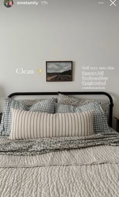 a bedroom with a bed, nightstand and pictures on the wall above it that says clean